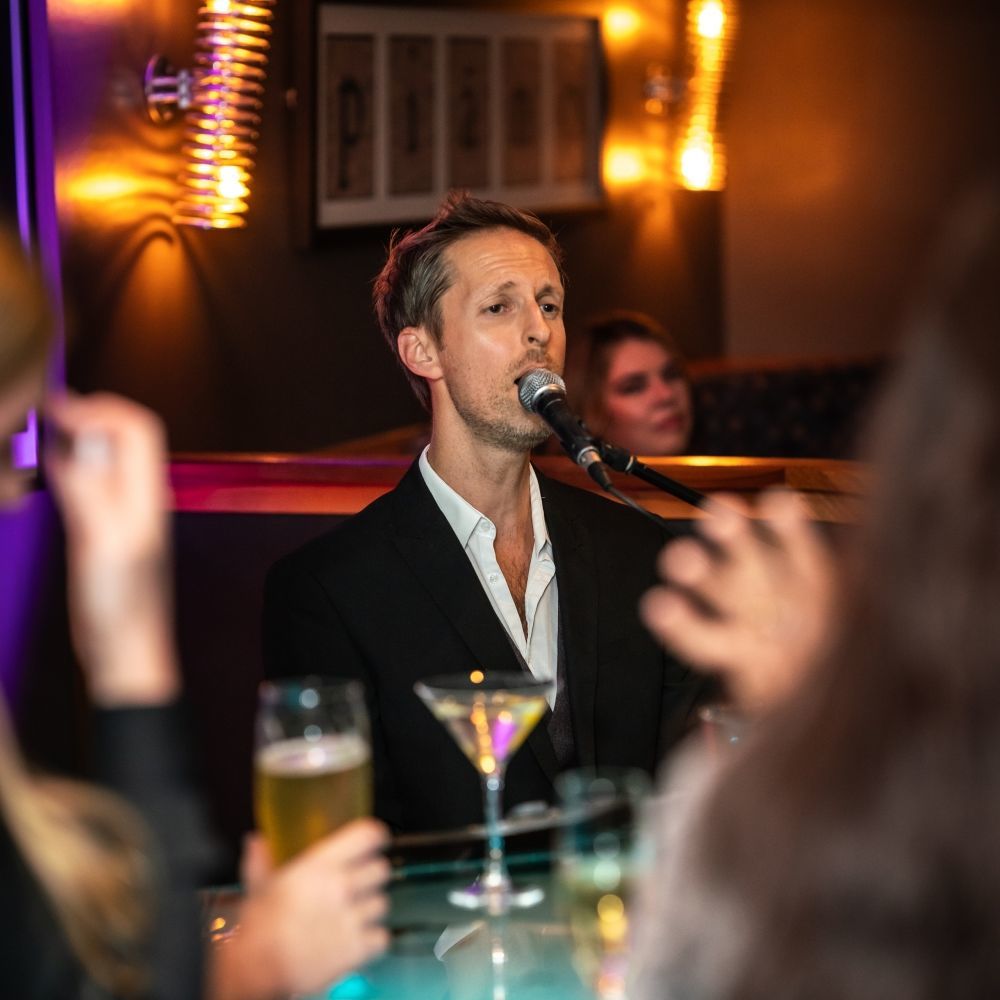 Piano Kensington, a cocktail bar with live piano performance daily.